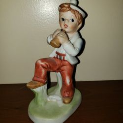 Boy with playing an instrument porcelain figurine 5 3/4"