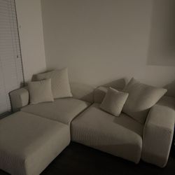 Three piece Suede Couch with Ottoman 