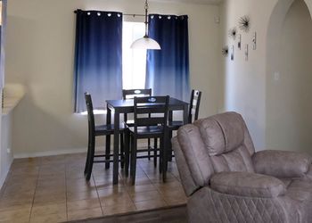 Stylish dark geyser table and 4 chairs.