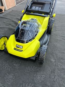 New Ryobi 40V HP brushless self-propelled lawn mower has a 20-inch cutting deck. This lime green and black cordless tool features rear-wheel drive and