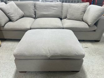 Sofa and ottoman 117”. Ottoman is 42”-34”