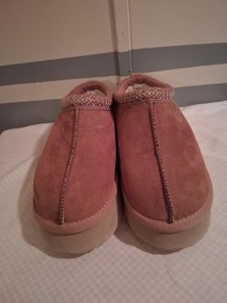 Like new women's size eight brown slippers featuring a platform sole and braided trim