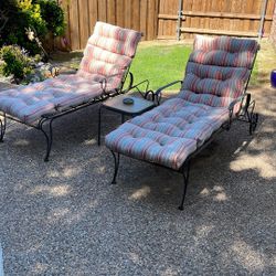 Poolside lounge, chairs, table, and cushions
