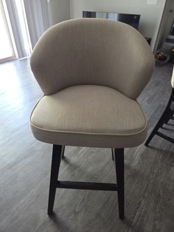 Armen Living Tan 26.0-in H Counter height Upholstered Swivel Wood Bar Stool