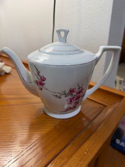 TEA POT AND A SUGAR HOLDER
