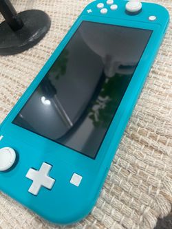 Nintendo switch lite teal almost mint condition
