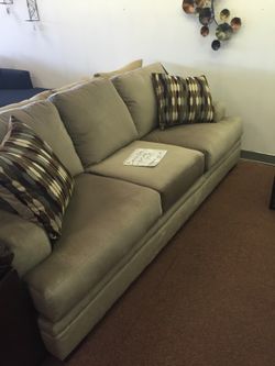 Grey Serta sofa and loveseat