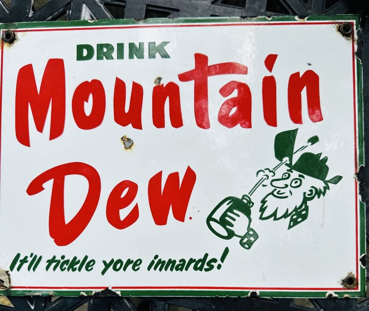 Mountain Dew porcelin sign 12 inches by 9 inches