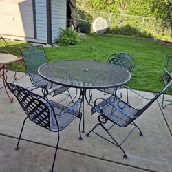 Solid Wrought Iron Patio Set, Table's H  30", W 48", Top Is Removable, 2 Rocking Chairs, 2 Stackable Chairs. 