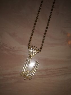 Iced out U pendant and 18 inch chain