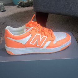 Orange nd White New Balance’s  Size 5.5 