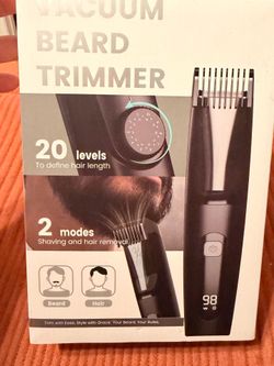 Vacuum beard trimmer