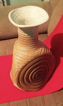 Tan colored clay decorative vase/plant holder
