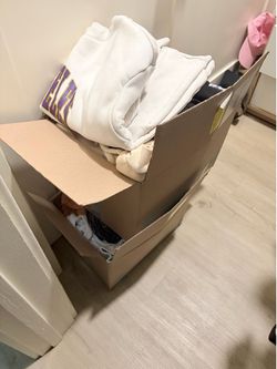 Two boxes of women’s clothing