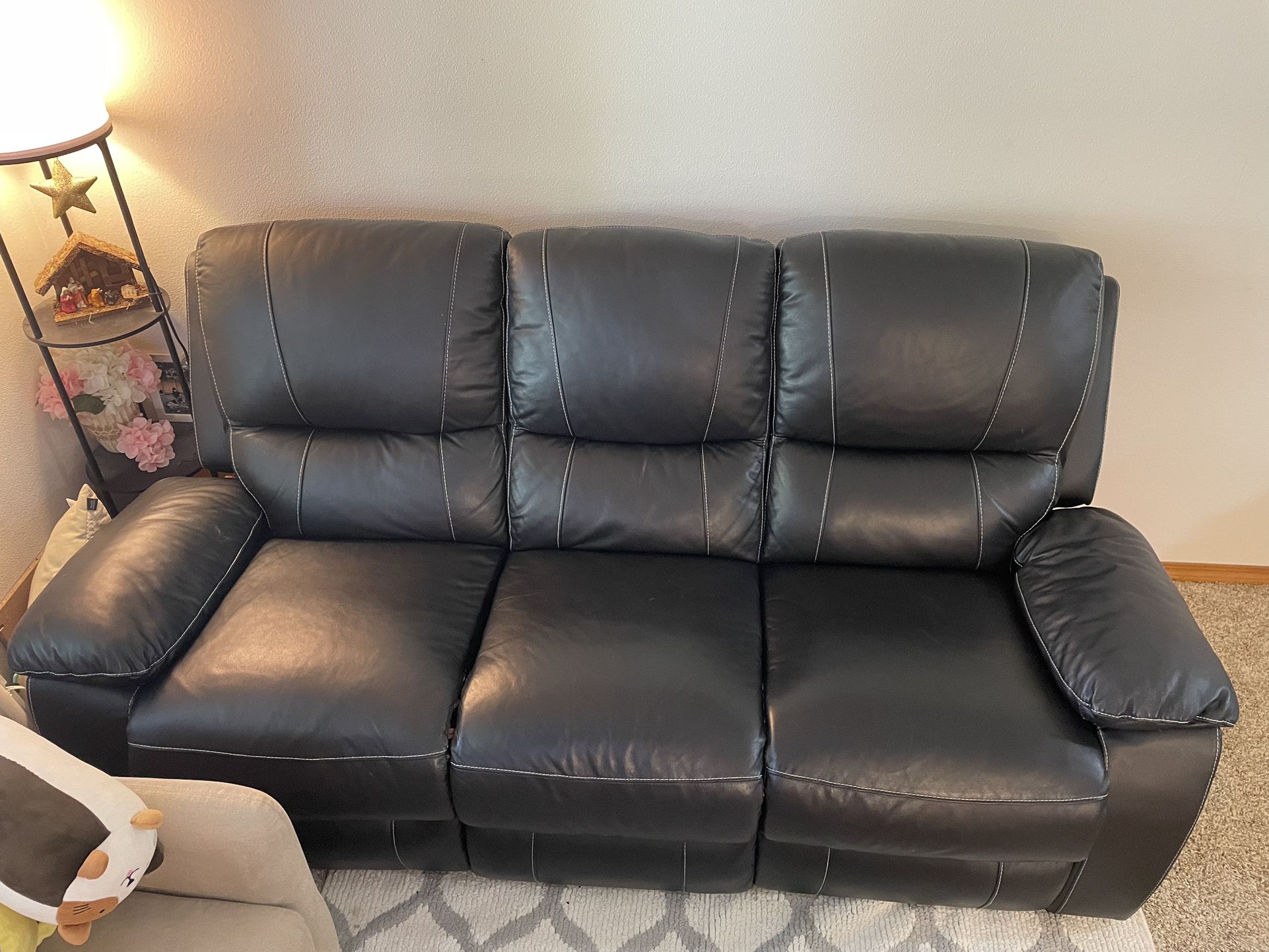 Ashley Faux Leather Manual Pull-Tab Reclining Sofa
