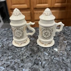 Vintage Beer Stein Cream color with gold color accent.  On the bottom says “Loma Products”.  Preowned no stoppers a lot of crazing.  