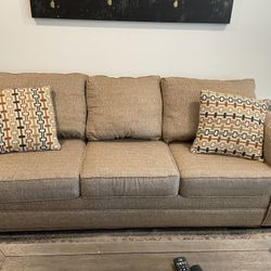 Beige Couch And Loveseat With Pillow.  PUO