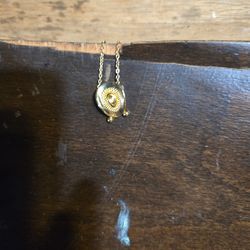pendant shaped like a cowboy hat