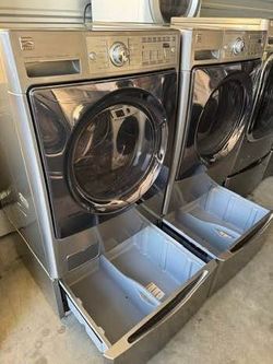 Graphite steel Front load Kenmore elite washer and front load Kenmore elite dryer electric  high efficiency square doors  with pedestals working perfe