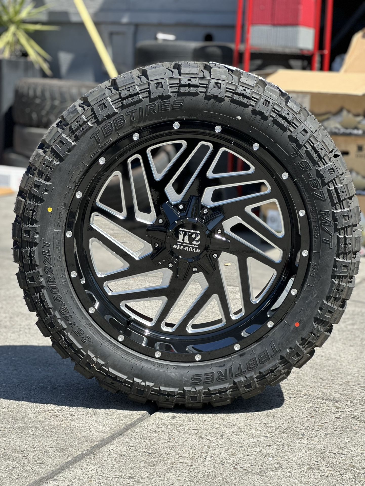 K2 22x10 8x165 gloss black milled with 35x12.50R22 TBB mud tires we finance credit no needed