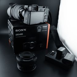 Sony A6400 with two lenses and additional batteries.