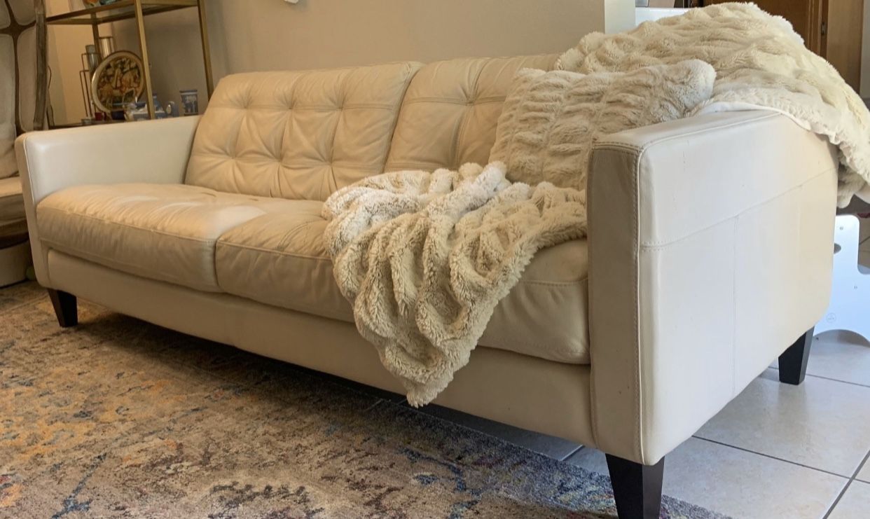 White leather sofa tufted couch