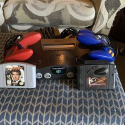 Nintendo 64 With Game, Shark And Golden 9007, And Two Controllers