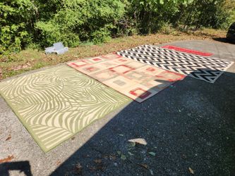 Several Spare Room Area Rugs