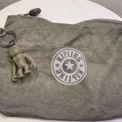 A cosmetic bag or wallet from the brand Kipling.