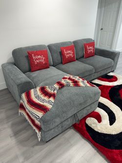 (Rooms To Go) "Marcola" Sectional Sofa with chaise and storage. Delivery available for an additional cost.