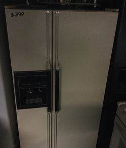 Whirlpool side by side refrigerator/ 90 day warranty/ delivery and installation are available