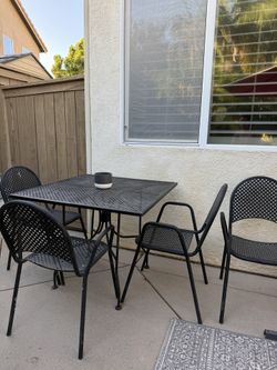 Black Metal table And Four Chairs