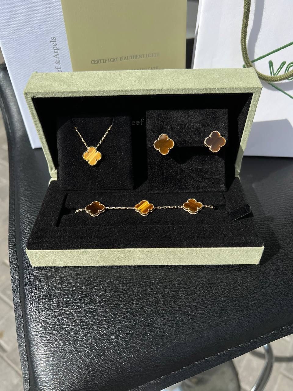 Van Cleef & Arpels Alhambra Collection 18k solid yellow gold box and papers Tiger eye motifs