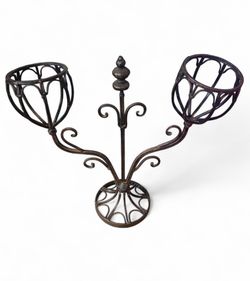 decorative wrought iron dual plant stand or metal floral centerpiece holder.