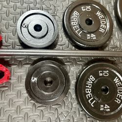 5 ft Standard Barbell with pairs of 25s, 10s and 5 pounders [ All Vintage and reconditioned equipment). Brute Weight= 95#