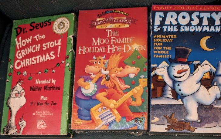 3 Christmas VHS Movie Classics Tapes For Children. Dr. Seuss How the Grinch Stole Christmas & I Ran The Zoo, (30 min). A piece of the upper right side
