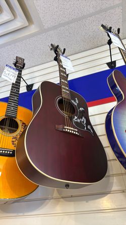 Acoustic Guitar with Hummingbird Inlay
