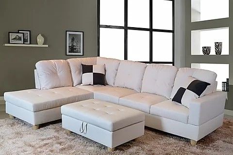 New white leather sectional and ottoman