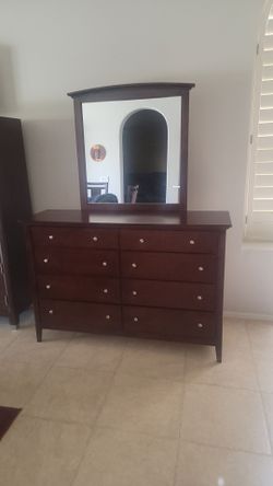 Wood dresser with large removable vanity mirror