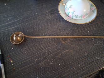 vintage brass candle snuffer (also known as a candle douter).