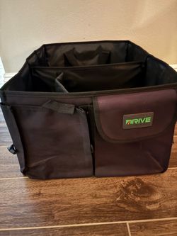 black, collapsible multi-compartment car trunk organizer made by Drive Auto Products.