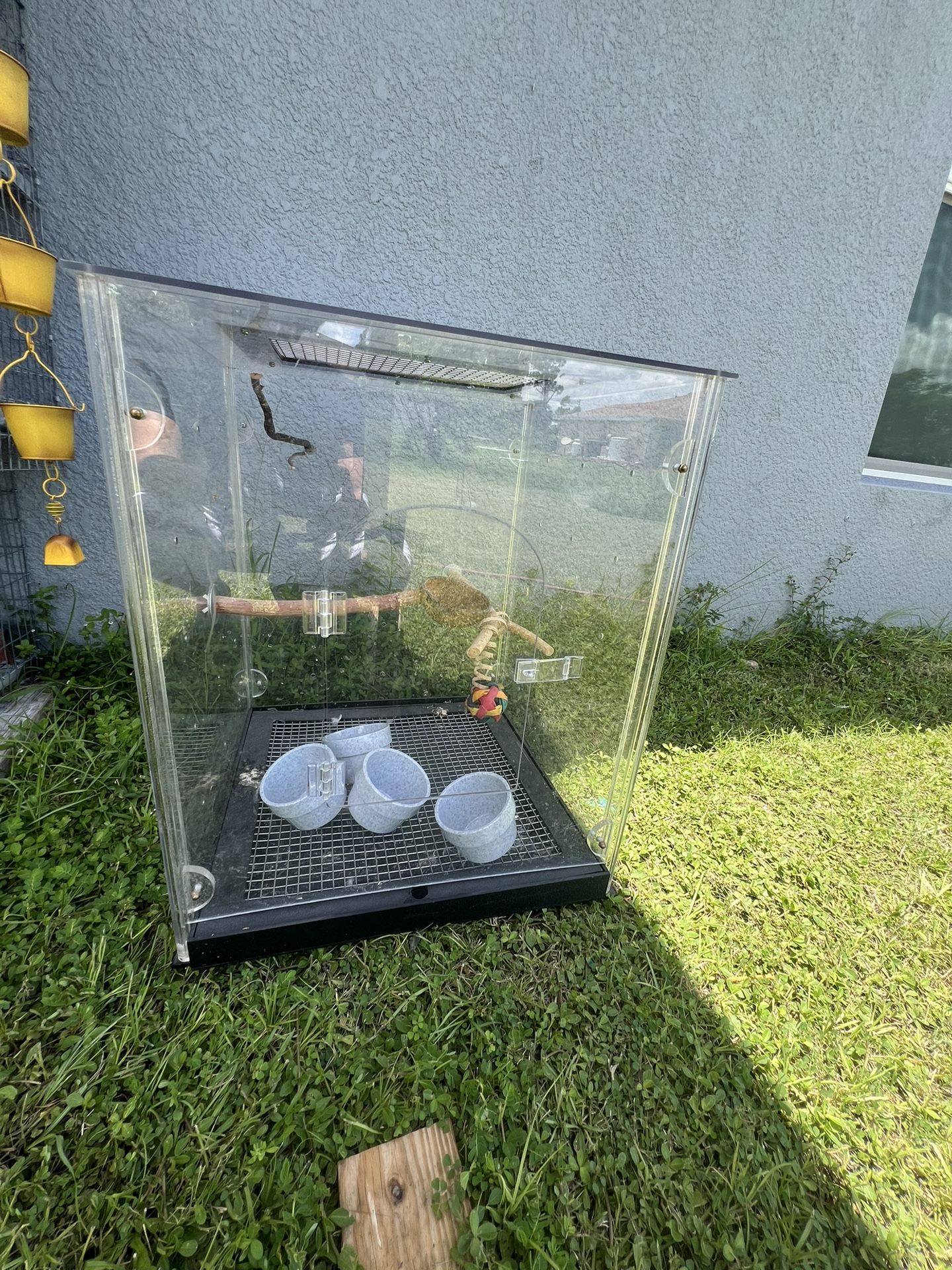Two Plastic Bird Cages