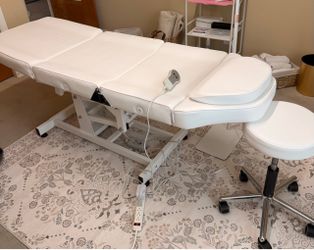 Electric Esthetician Facial Bed + Rolling Stool .