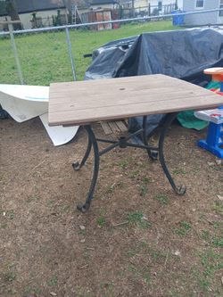 Solid Wooden Table The Base Is Wrought Iron Very Heavy Duty Bring Help To Load 