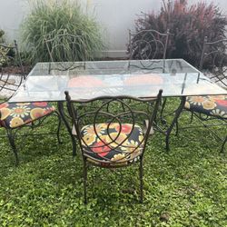 Wrought Iron Table With Glass Top And 5 Chairs