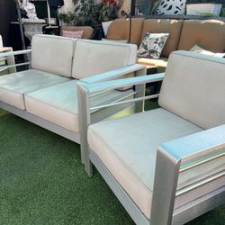 Beautiful 3-piece aluminum patio set in good condition. The cushions need cleaning or the covers are sun-faded but not torn.