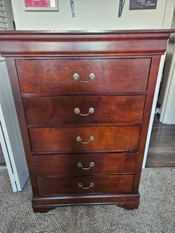 Tall brown dresser