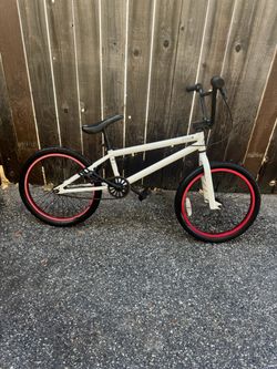 2 Freestyle Bikes, White and Black Frame Red Rims FRAMED