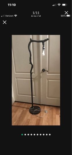 Rustic floor lamp finished in faux wood textured bronze