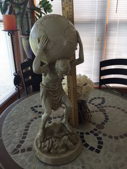 Atlas holding up World globe